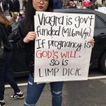 #1 A Protester Holding A Sign For Women’s Rights, 2017