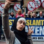 #10 Zakia Belkhiri Takes A Selfie At An Anti-Muslim Demonstration In Antwerp, Belgium 2016