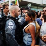 #18 An Israeli Woman Stands Up Against Police Brutality At A Protest In Tel-Aviv