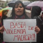 #36 A Woman In Buenos Aires Protests With A Sign That Says Stop Sexist Violence
