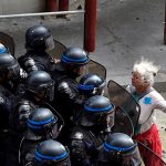#39 A Woman Stands In Front Of Police Officers As They Block Access To A Street During A Protest Against Proposed Labour Reforms In Paris, 14 June 2016