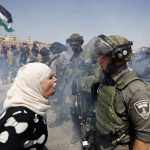 #41 A Palestinian Woman Argues With An Israeli Border Policeman During A Protest Against Jewish Settlements In The West Bank Village Of Nabi Saleh