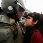 #5 A Demonstrator Faces Down A Riot Policeman During A Pro Democracy Protest In Santiago, Chile, 11 September 2016