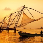 Sunset-over-Chinese-Fishing-nets-and-boat-in-Cochin-Kochi-Kerala-India-shutterstock_104171129